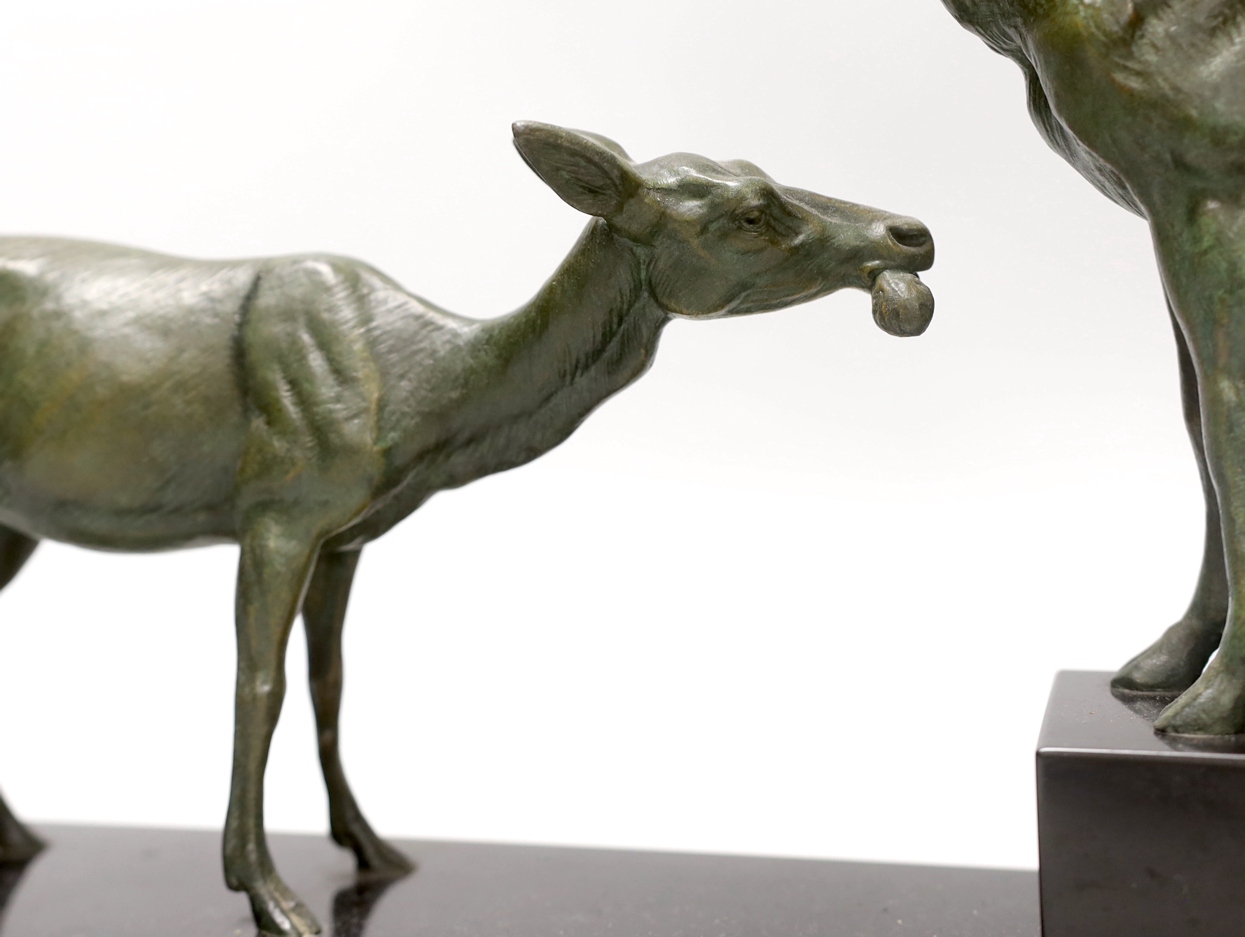 After Louis-Albert Carvin (1875–1951). A spelter group of a stag and faun, signed to base. 41cm tall